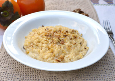 Risotto cachi, gorgonzola e noci